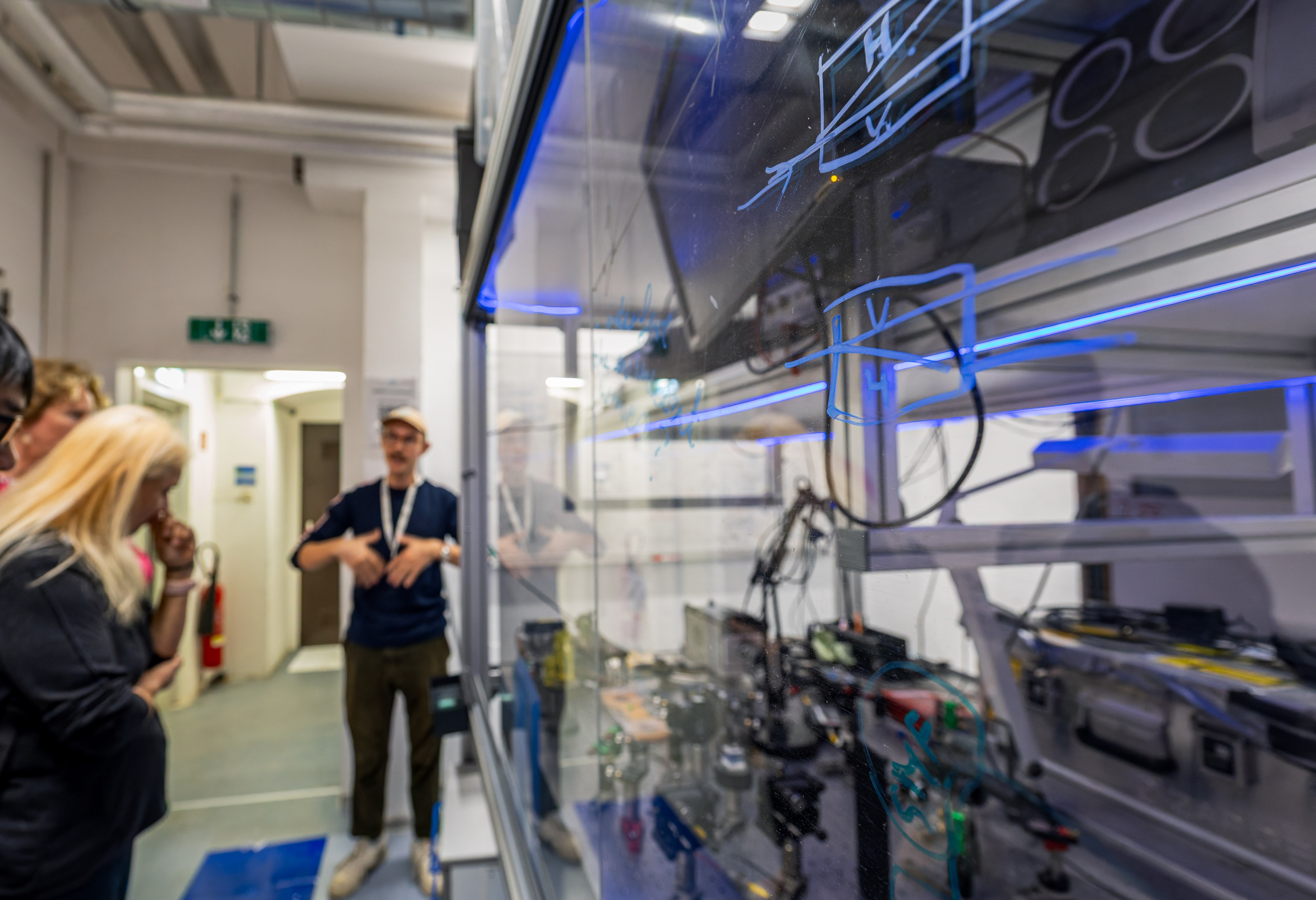 Scientist in the lab, talking to the visitors