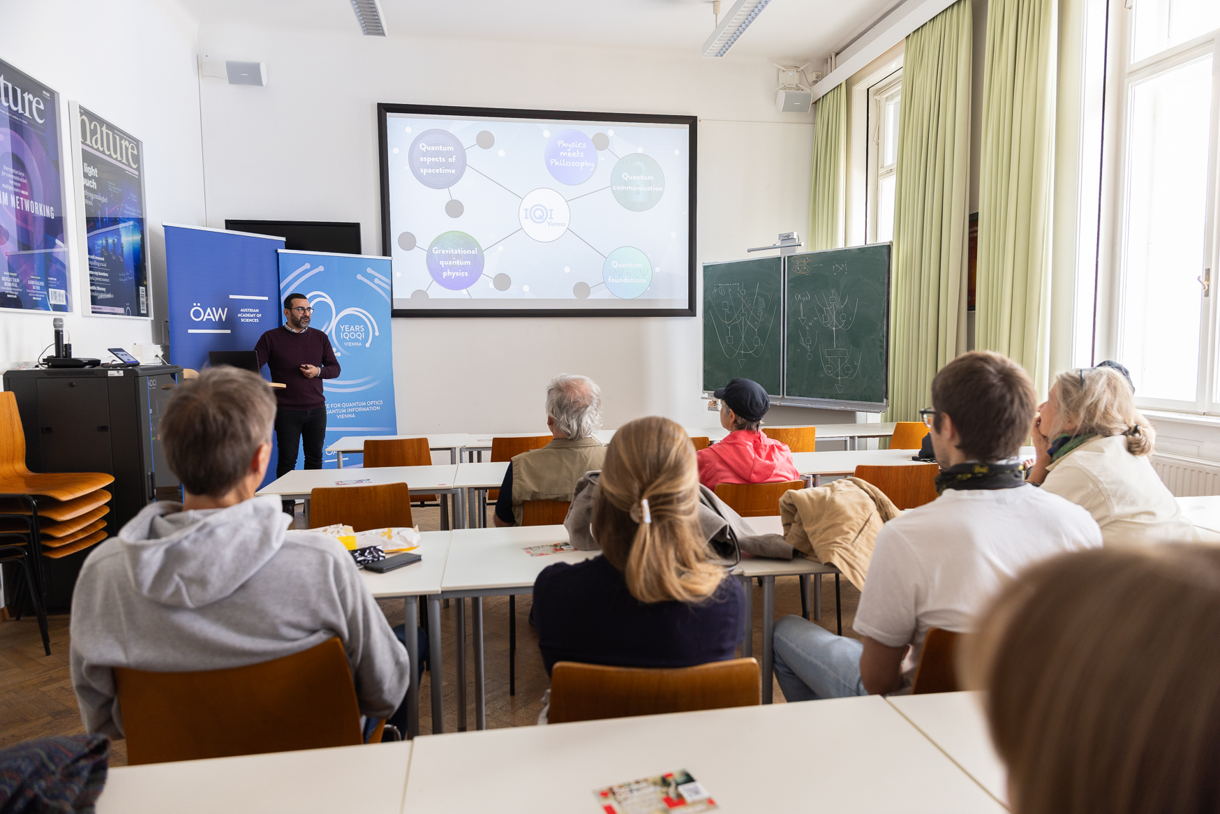 people following a power point presentation in the seminar room 