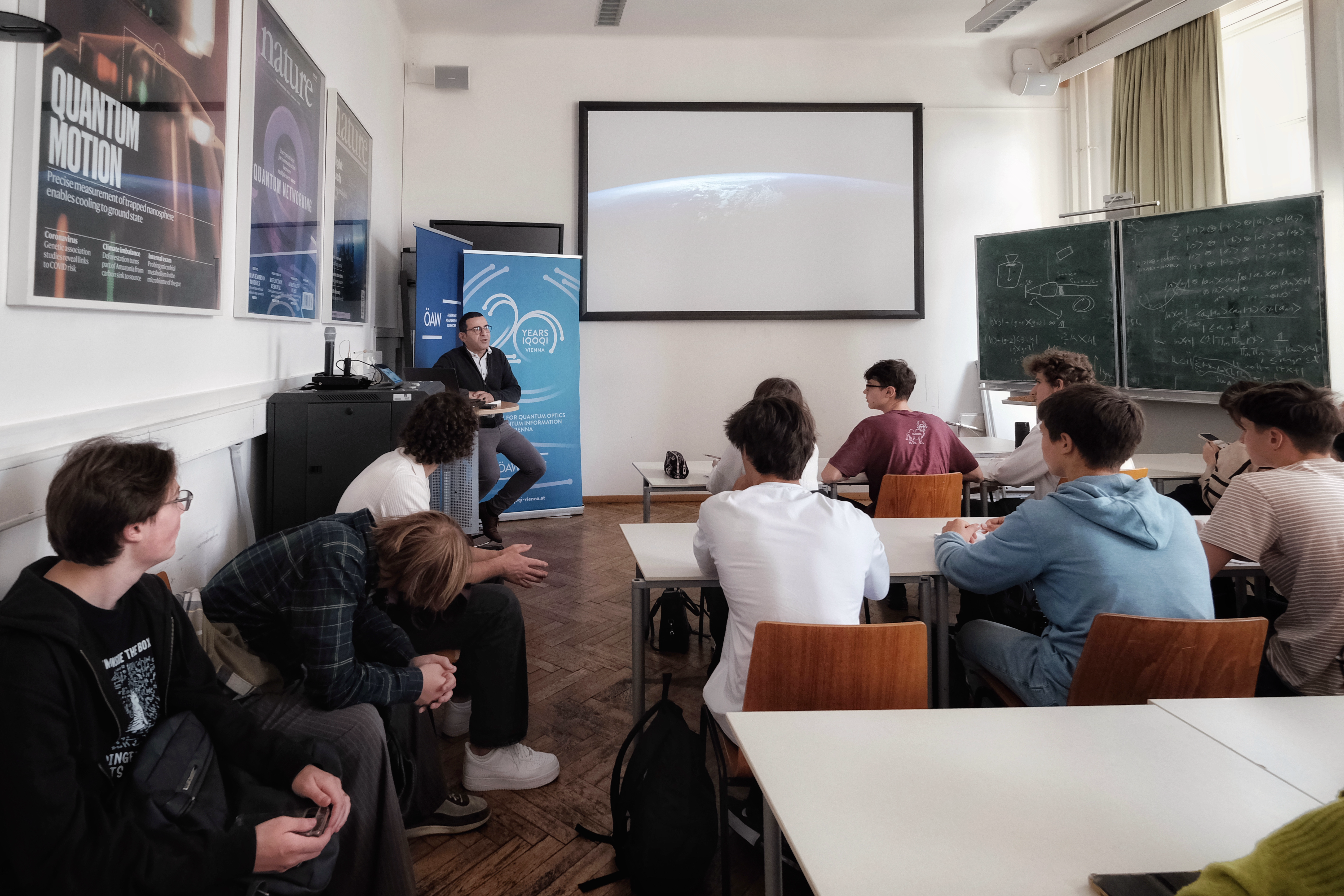 Students sitting the seminar room, listening to a presentation