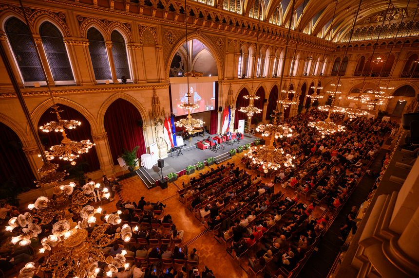 The ballroom of the Vienna City Hall full of people waiting for the event to start 
