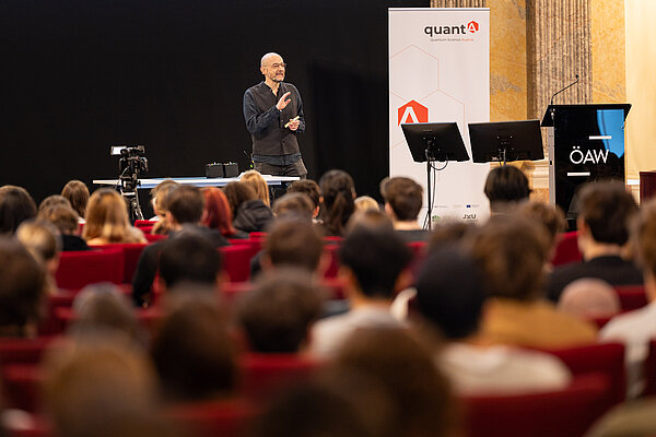 A scientist standing on the podium, talking to the audience 