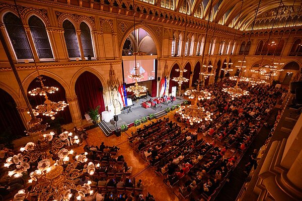 The ballroom of the Vienna City Hall full of people waiting for the event to start 